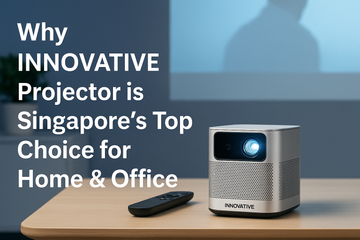 INNOVATIVE Projector on a wooden table projecting a movie scene, with text overlay stating ‘Why INNOVATIVE Projector is Singapore’s Top Choice for Home & Office